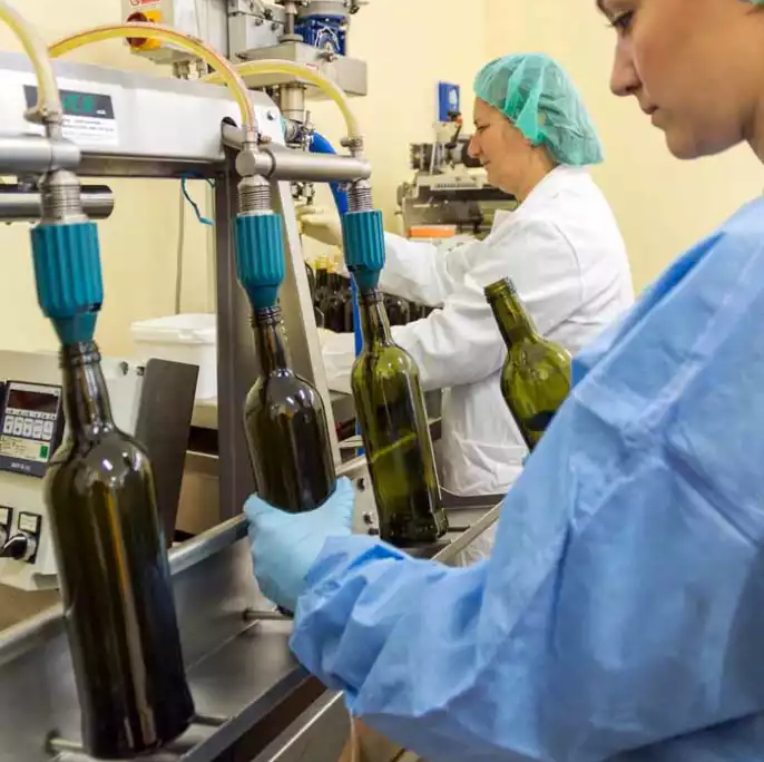 The whole family works on bottling the olive oil